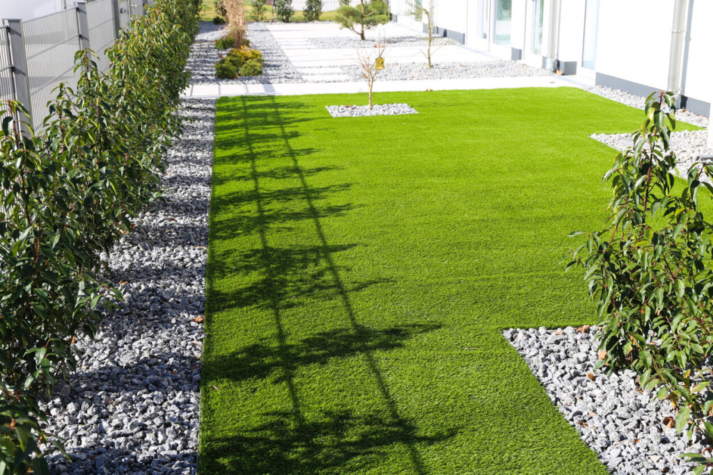 Back yard with very neat rolled artificial grass